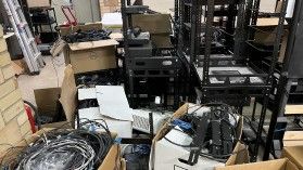 Random piles of equipment, cables, and boxes