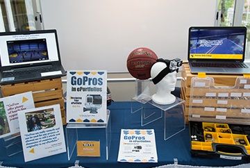 presentation table with tablets showing go pro camera footage